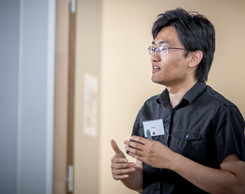 Xiang Fan presenting at a 2017 conference